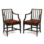 A pair of mahogany carver chairs with upholstered drop-in seats, on square tapering legs (2).