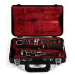 A Selmer Console clarinet in associated case.