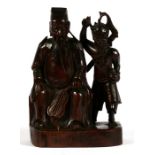 A 19th century Japanese carved hardwood group depicting a seated robed gentleman and a demon, 15.