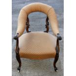A 19th century rosewood tub chair with upholstered seat, on cabriole legs.