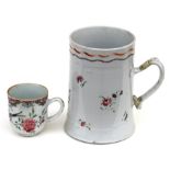 A Chinese 18th century famille rose tankard, 14cms (5.5ins) high; together with a similar tea cup;