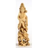 A late 19th / early 20th century Japanese carved ivory figure depicting Kwanon standing on a