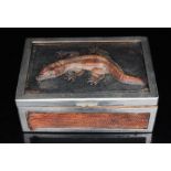 An Art Deco plated and lizard skin cigarette box decorated with lizards to the top, 14cms (5.5ins)