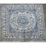 A Persian Nain Tabas woollen handmade rug with floral decoration on a cream ground, 195 by 180cms (