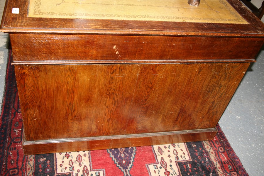 An early 20th century oak twin pedestal partner's desk, the top with green inset leather top, - Image 10 of 11