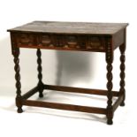 A Jacobean style oak side table with single frieze drawer, on barleytwist supports joined by