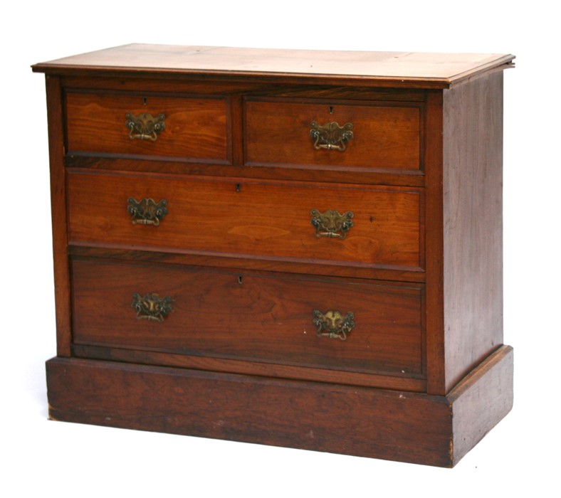 A late 19th century walnut chest of two short and two long graduated drawers on plinth base,