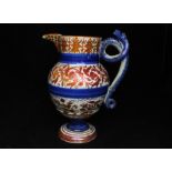 An 18th / 19th century copper lustre jug decorated flowers, with coiled serpent handle, 27cms (10.