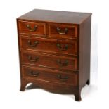 A Regency style mahogany chest of small proportions with two short and three long graduated drawers,