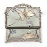 A waisted rectangular frosted glass trinket box decorated with flowers, leaves and a butterfly,