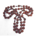 A Buddhist Mala Bodhi seed nut prayer bead necklace.