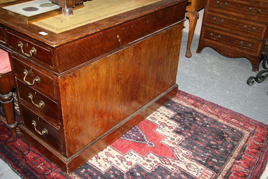 An early 20th century oak twin pedestal partner's desk, the top with green inset leather top, - Image 9 of 11