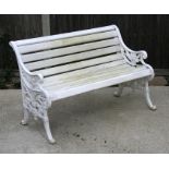 A white painted cast iron garden bench with wooden slatted seat, 116cms (45.75ins) wide.