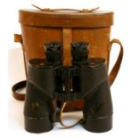 A pair of WW2 Royal Navy 7 x 50 binoculars in their original leather case, manufactured by the