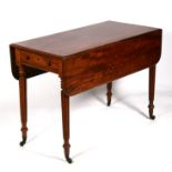 A Victorian mahogany Pembroke table on turned reeded legs, 102cms (40ins) wide.Condition Report