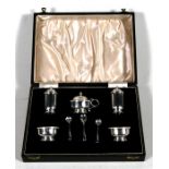 A cased five-piece silver cruet set.