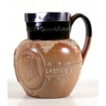 A Victorian Doulton Lambeth stoneware Victoria commemorative jug with silver rim, 18cms (7ins)