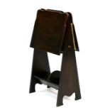 An Edwardian oak magazine rack or folio stand, 42cms (16.5ins) wide.