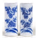 A pair of Japanese blue & white wall pockets, 21.5cms (8.5ins) high.