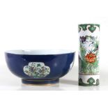 A Chinese footed bowl decorated with flowers within panels on a pale blue ground, 30cms (11.75ins)