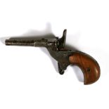 A 19th century steel rim starting pistol with walnut handle, 11.5cms (4.5ins) long.