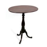 A 19th century oval mahogany tripod table, 64cms (25ins) wide.