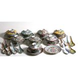 A set of eight assorted pattern Chinese famille rose twin-handled soup cups on stands, with matching