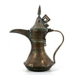A Turkish / Islamic brass dallah coffee pot, 24cms (9.5ins) high.