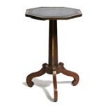 A 19th century walnut occasional table, the octagonal brass bound top with inset leather, on
