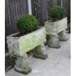 A pair of well weathered rectangular planters on lion supports, 76cms (30ins) wide (2).