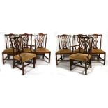 A set of six mahogany dining chairs together with two similar carvers, with pierced splats and