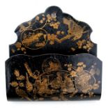 A Victorian chinoiserie papier mache lacquered wall pocket decorated with figures and birds,
