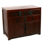 A Chinese lacquered hardwood cupboard with an arrangement of five short drawers above a cupboard,