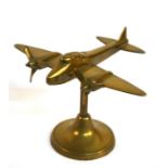 A brass model of the WW2 de Havilland DH98 Mosquito mounted on a brass base. Wingspan 20cms (8ins)