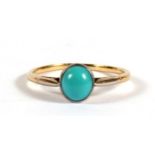 A yellow metal dress ring set with a single turquoise cabochon, approx UK size 'M'.