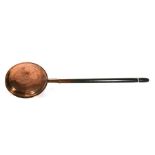 A 19th century copper warming pan