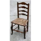 An 18th / 19th century rush seated ladder back chair.