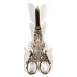 A pair of silver grape scissors, the handles decorated with grapes, vines and a running fox, 15.5cms