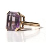 A 9ct gold dress ring set with a large rectangular amethyst. Approx UK size QCondition Report Gem