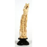 A late 19th / early 20th century Chinese carved ivory figure depicting Shoulau, 22cms (8.5ins)