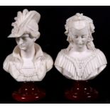 A pair of resin Parian style busts depicting young ladies, 24cms (9.5ins) high.