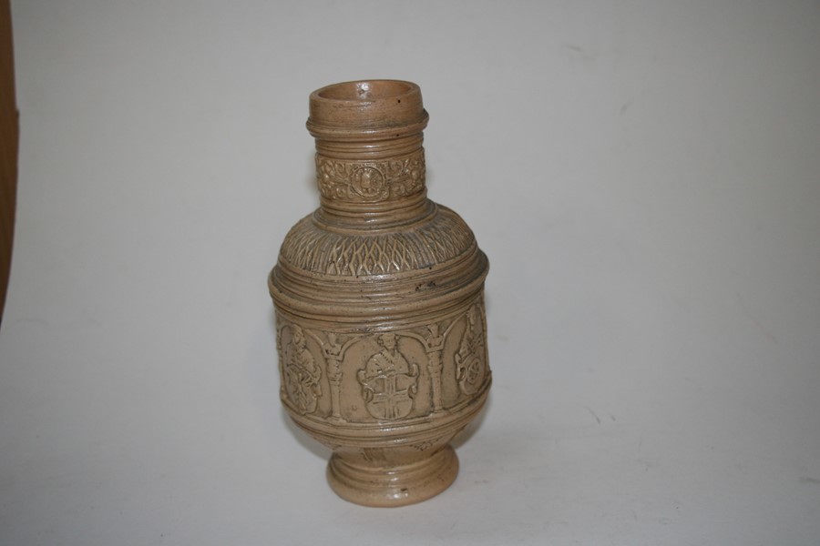 A German stoneware jug decorated with figures and heraldic crests, 22cms (8.5ins) high.Condition - Image 6 of 8