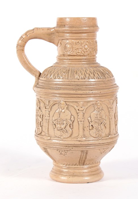 A German stoneware jug decorated with figures and heraldic crests, 22cms (8.5ins) high.Condition