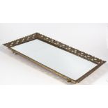 A pierced brass and mirrored rectangular tray, 56cms (22ins) wide.