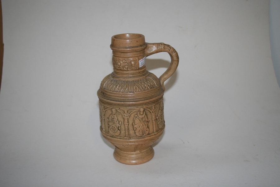 A German stoneware jug decorated with figures and heraldic crests, 22cms (8.5ins) high.Condition - Image 3 of 8