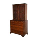 A 19th century mahogany secretaire bookcase, the astragal glazed doors enclosing a shelved interior,