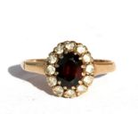 A 9ct gold garnet cluster ring, approx UK size 'L'.