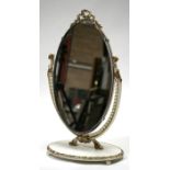 An oval Peerart dressing table mirror, 36cms (14.25ins) wide.