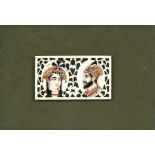 An Indian pierced bone panel with portrait miniatures depicting a lady and a gentleman, 6cms (2.