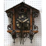 An early 20th century Black Forest wall mounted cuckoo clock, 41cms (16ins) high.